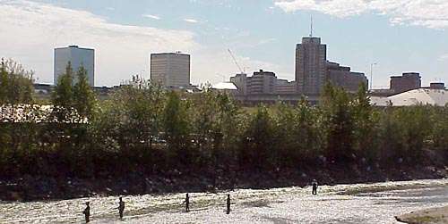 Ship Creek fishermen and the downtown skyline