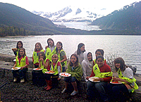 Girl Scout Troop 4033 and some Junior Girl Scouts enjoy lunch after trash pickup near Skater's Cabin.
