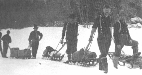 Men Pulling NCC Sleds Using a Gee Pole