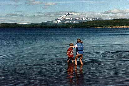 Playing in view of volcanic Mt. Peulik