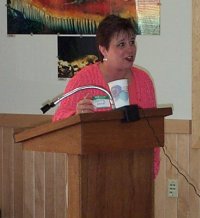 Bonnie Kenk, at the podium at the 2001 Alaska Bird Club Companion Bird Conference (photo by Garry Wallan)