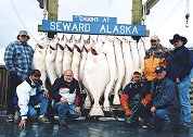 May 25, 2003, Obiously, from looking at theses happy anglers and their huge catch, May is a great time to go halibut fishing in Seward Alaska.