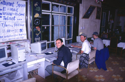 Omar, Eric, and Ian checking their emails at the Lhasa internet Cafe.