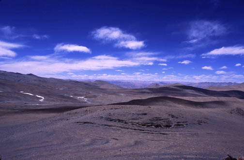 The Tibetan Plateau... miles and miles of dust and dirt under stark, blue sky.