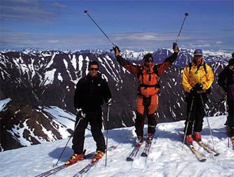 tommy moe and clients at the top of the run