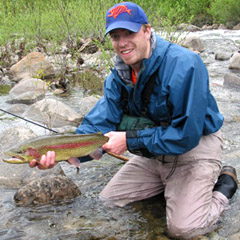 Guide Kelsey Kaso with beautiful stream caught rainbow.