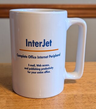 The original Whistle mug, back: InterJet, Complete Office Internet Peripheral. E-mail, Web access, and publishing productivity for your entire office.