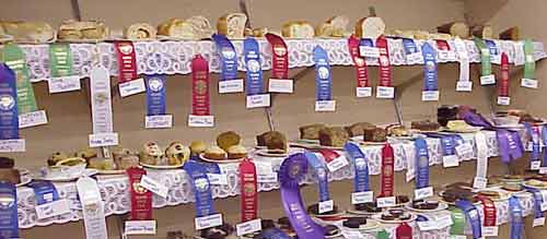 Rows of bakery goods with ribbons