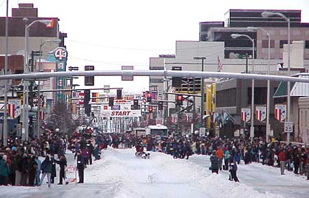 A team leaves the starting gate in the 2002 Iditarod