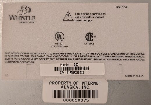 Bottom label of an InterJet 200: S/N 012008370043, 12V 2.5A, with an Internet Alaska asset tag.