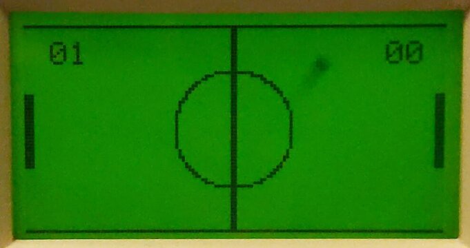 InterJet Smashball in play on the front-panel LCD: two paddles, a centre line and circle, the score 01 to 00.