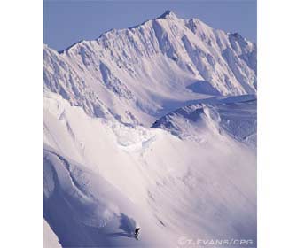 snowboarder with byron headwall